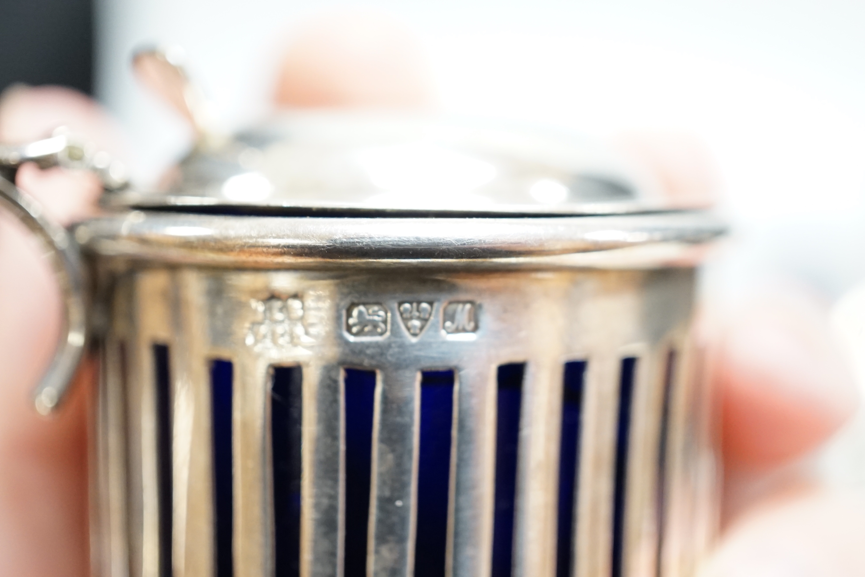 Eight assorted silver condiments, including a George III oval salt and four other items including small inkwell.